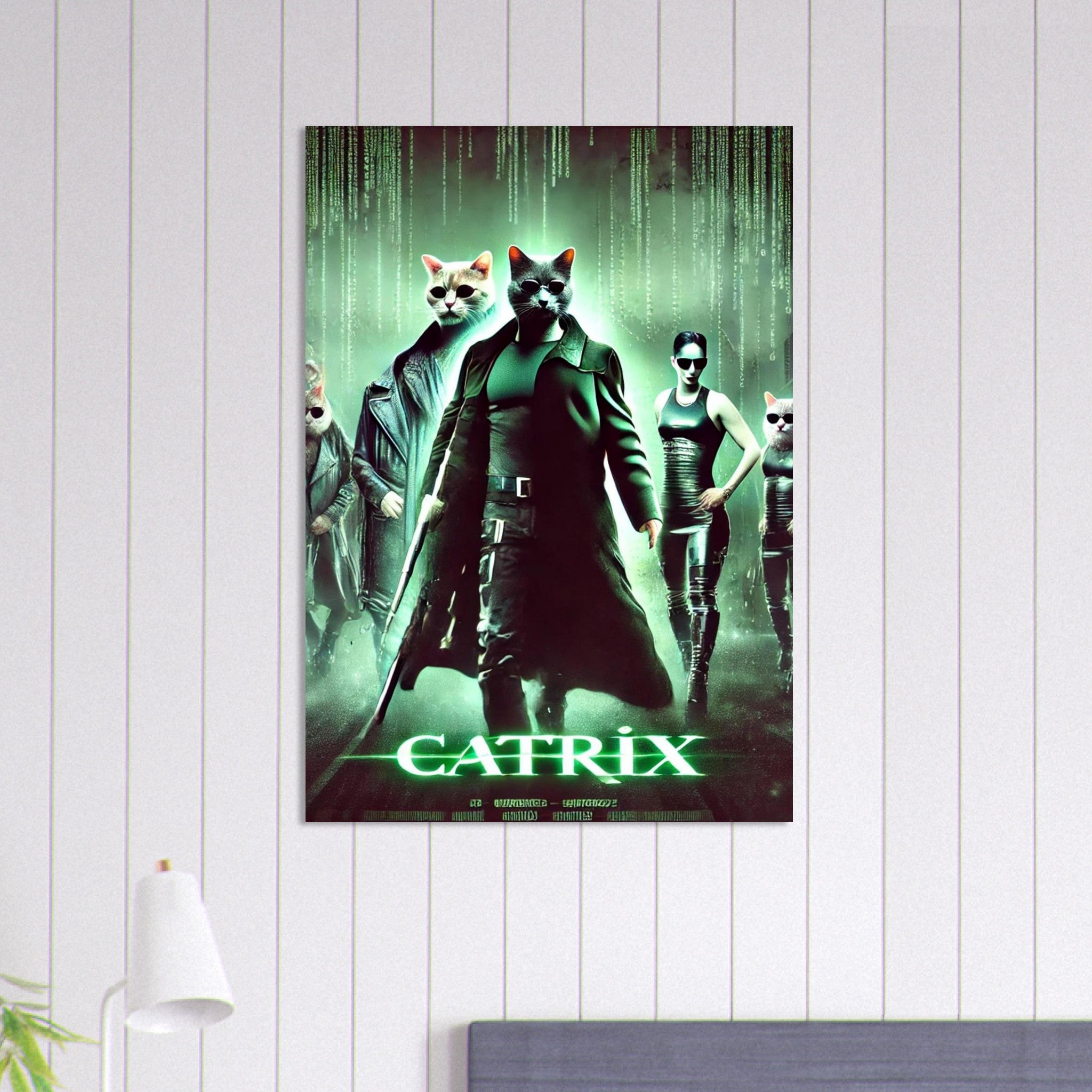 Poster « Catrix » montrant un chat humanoïde en long manteau noir et lunettes de soleil, armé d’un fusil, flanqué de deux autres chats agents et d’une femme en cuir, sur fond de pluie de code vert façon Matrix.